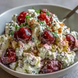 Wholesome cottage cheese breakfast bowl with fresh berries and crunchy seeds, drizzled with honey for a naturally sweet start.  