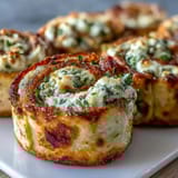 Creamy Turkey & Spinach Pinwheels: soft tortillas rolled with savory turkey, cheddar cheese, and vibrant greens, ideal for quick appetizers.