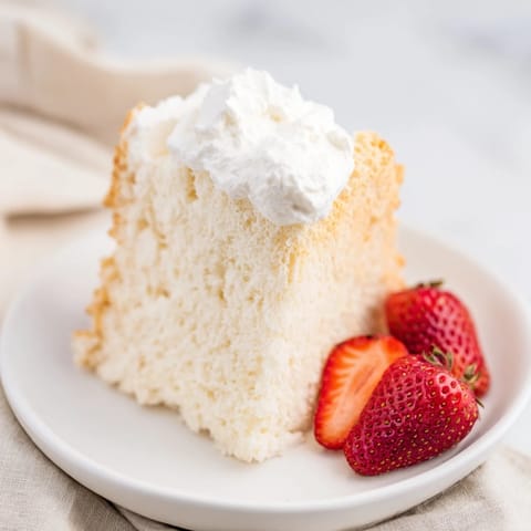 Light-as-air angel food cake showcased; imagine the sweet aroma and a delicate crumb.