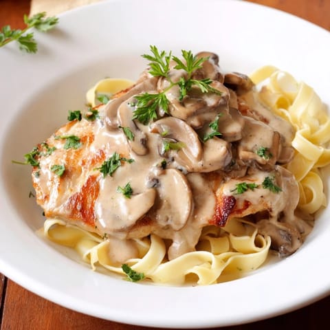 Tender chicken cutlets simmered in a rich Marsala wine and cream mushroom sauce, topped with fresh parsley.  